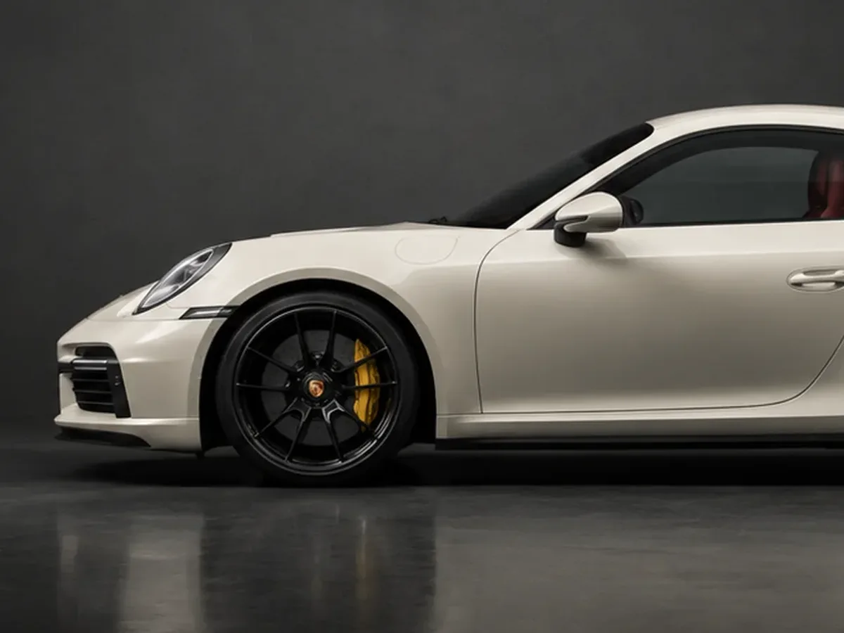 911 configured in Pearl Ivory with a Bordeaux interior and standard wheels