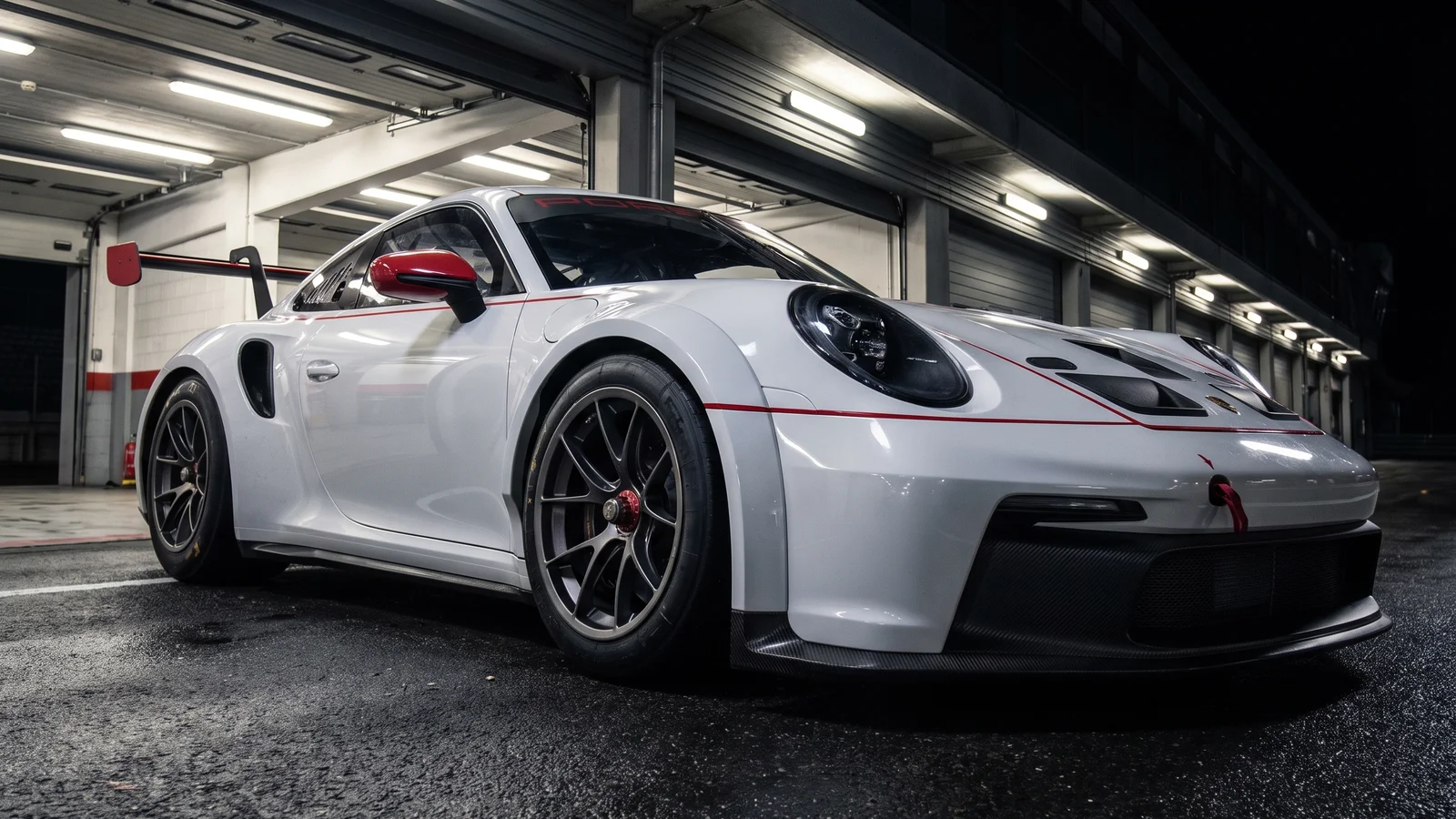 GT race car standing on a wet pit lane